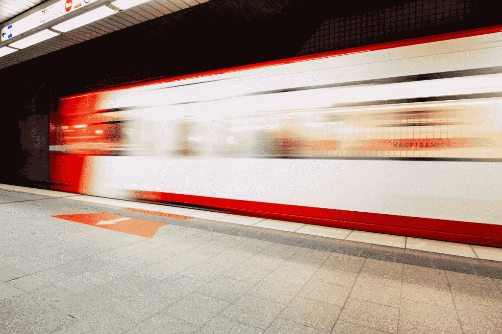 Prague metro train arriving at platform with motion blur