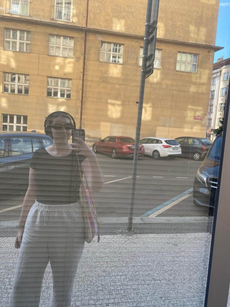 Anne Carrington taking selfie in Prague during her Master's program and residence permit process