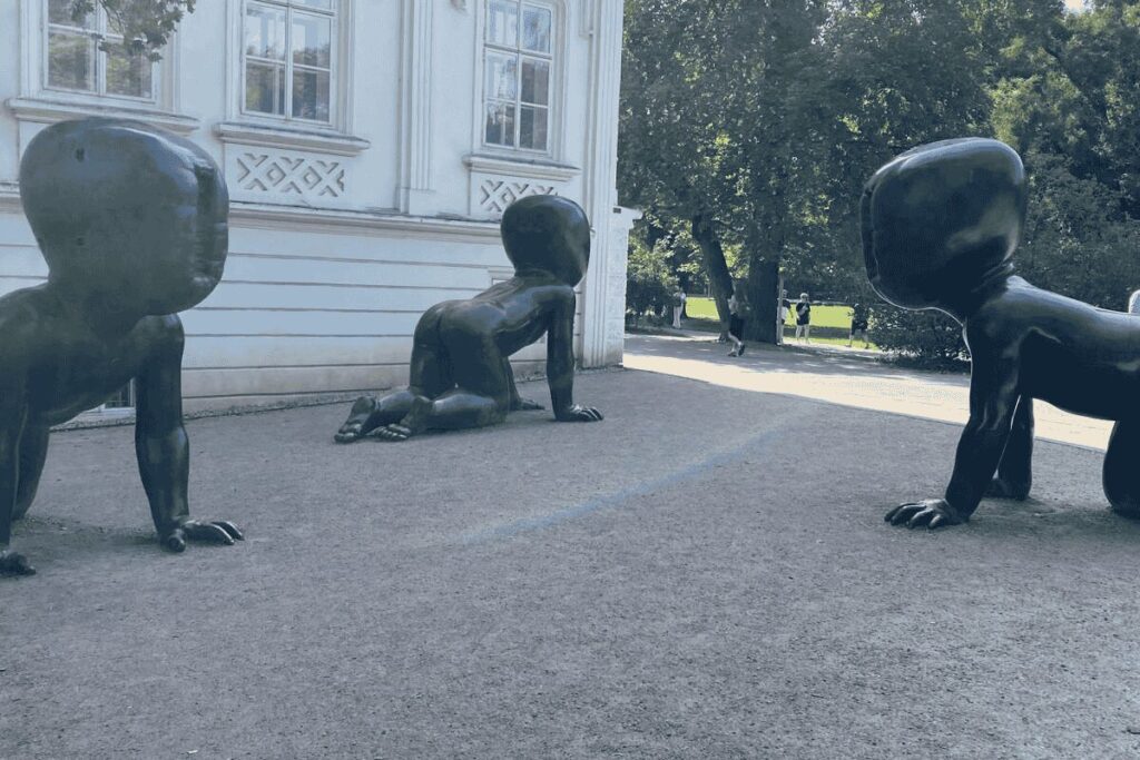 Faceless baby sculptures by David Černý in Kampa Park near the Vltava River in Prague