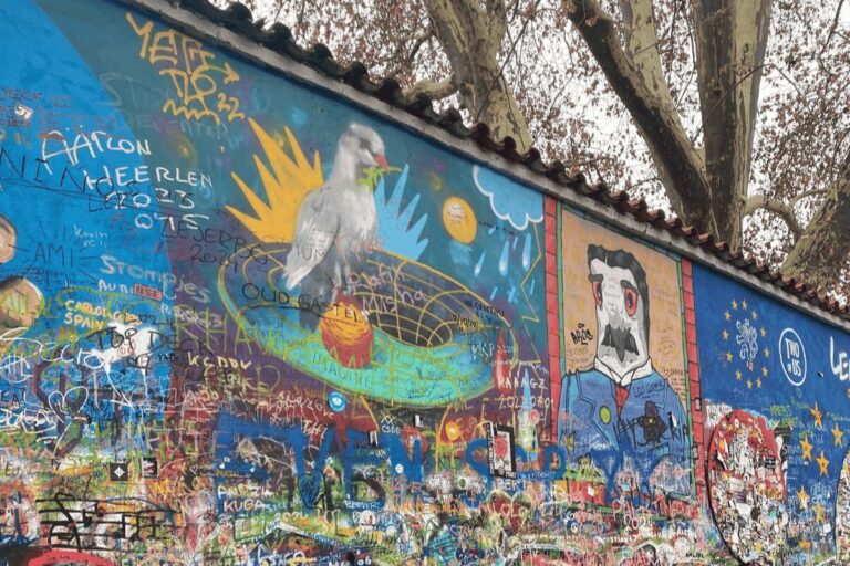 Colorful graffiti and murals covering the John Lennon Wall in Prague’s Malá Strana district