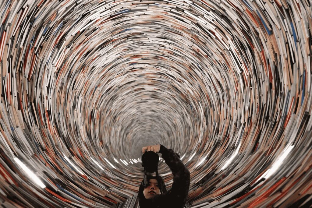 Infinity book tower sculpture inside Prague Municipal Library in Old Town.