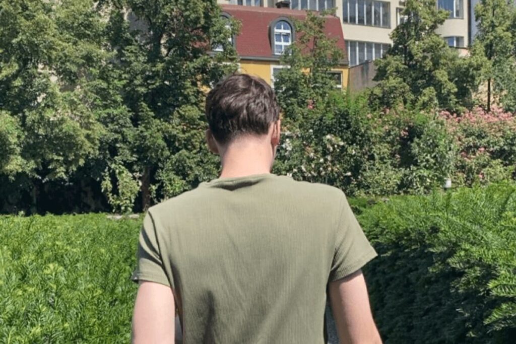 Walking path through Franciscan Garden in Prague surrounded by greenery in the city center.