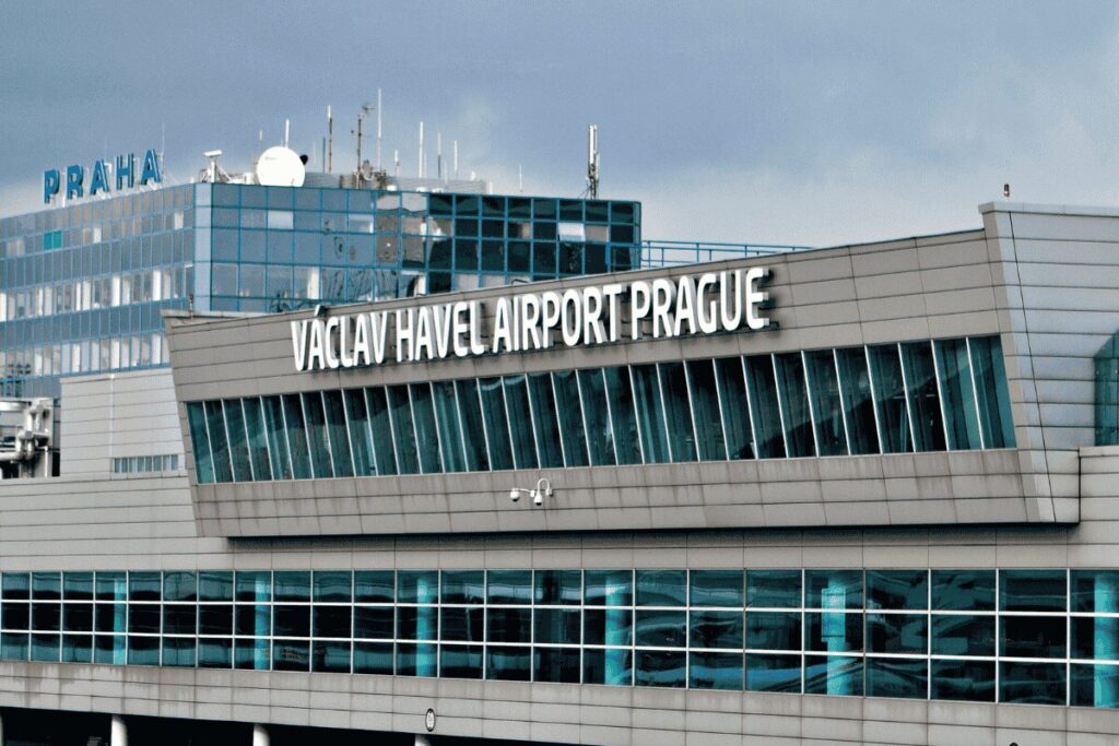 Exterior of Václav Havel Airport Prague with the airport name displayed on the building facade