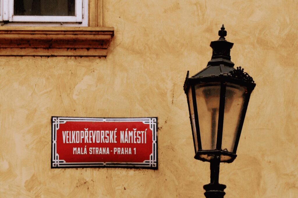Street sign and historic lantern in Malá Strana, Prague’s Lesser Town district.